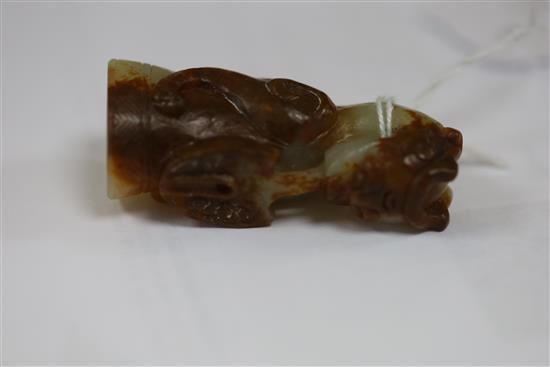 A Chinese pale celadon and russet jade finial, Song dynasty or later, H.5.4cm